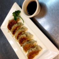 Pan Fried Gyoza · Minced Pork with vegetables wrapped in Gyoza Skin and pan fried