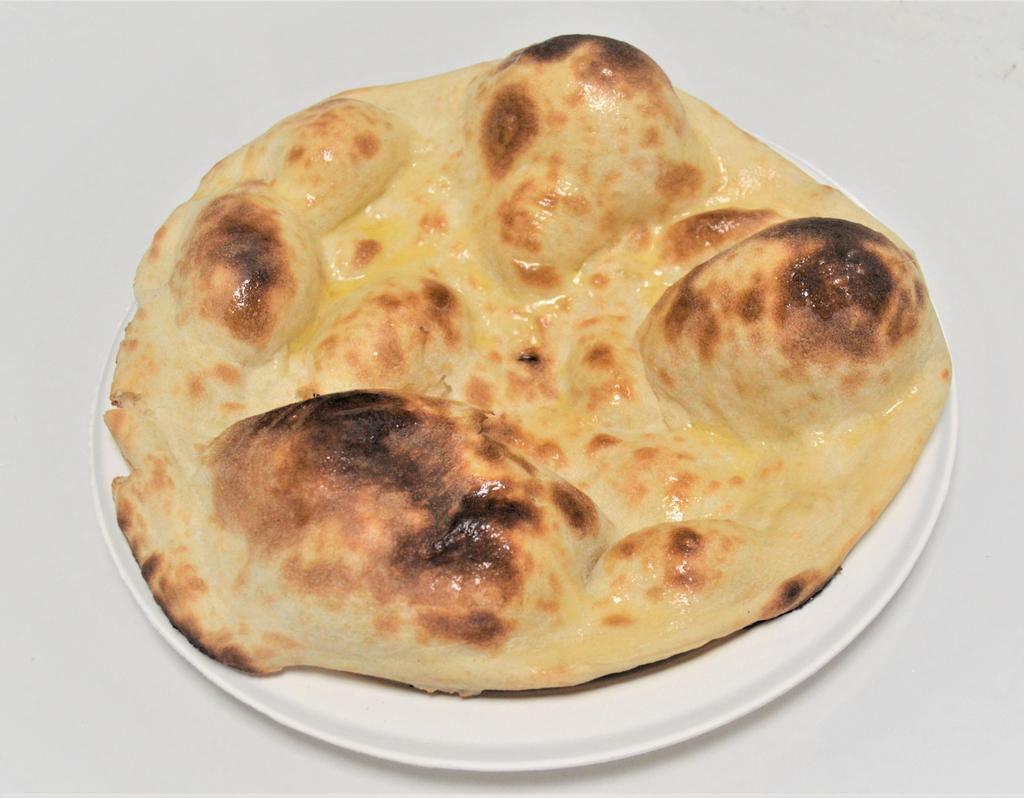 16. Butter Naan · White flour bread with butter.
