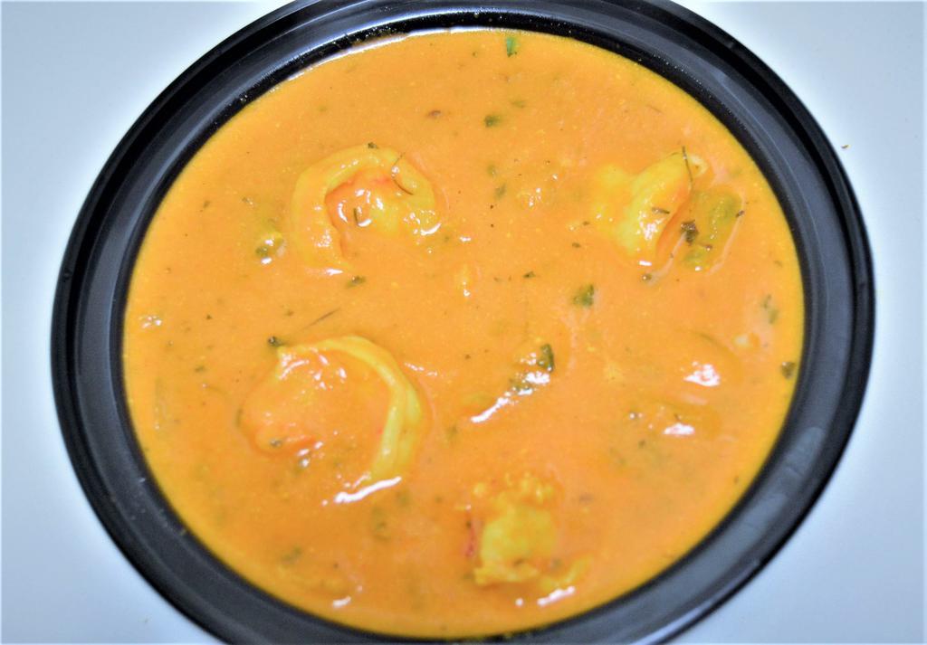 45. Shrimp Curry · Shrimp cooked with fresh tomato, ginger, garlic and onions. Prepared in an authentic sauce, spices and coconut milk. Served with rice.