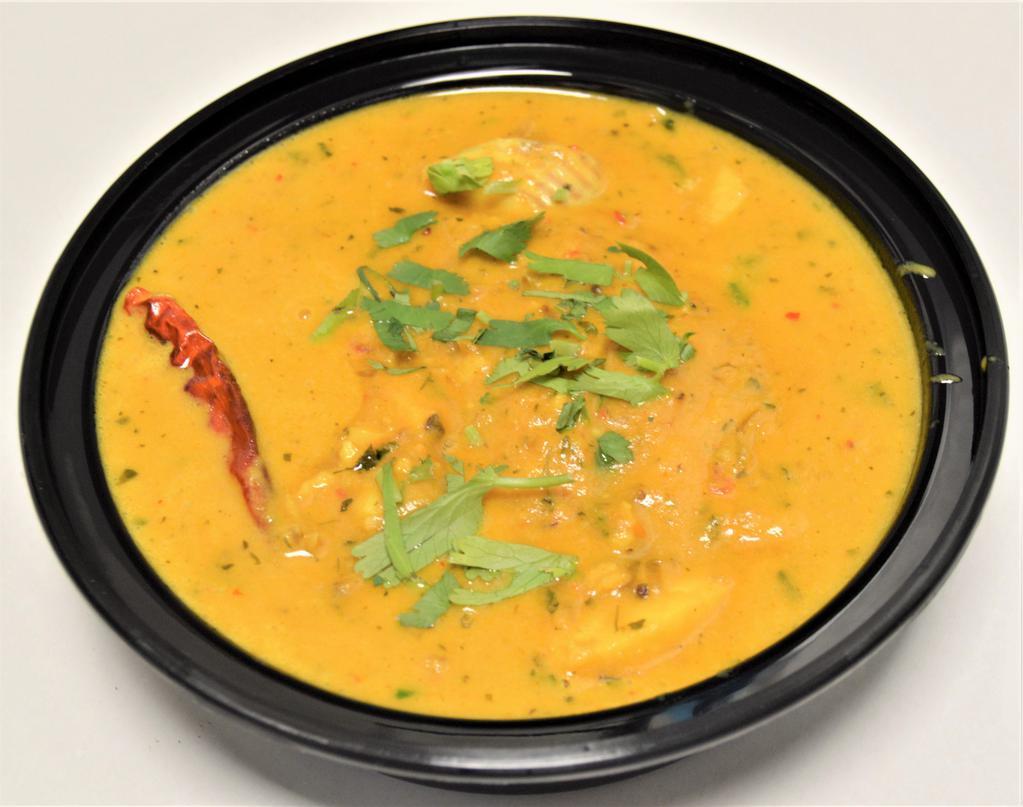 48. Fish Curry Tilapia · Tilapia cooked with fresh tomato, ginger, garlic and onions. Prepared in an authentic sauce, spices and coconut milk. Served with rice.