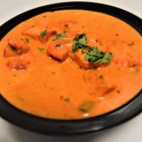 50. Chicken Tikka Masala · Cooked with tomato sauce, bell peppers and onions. Served with rice.