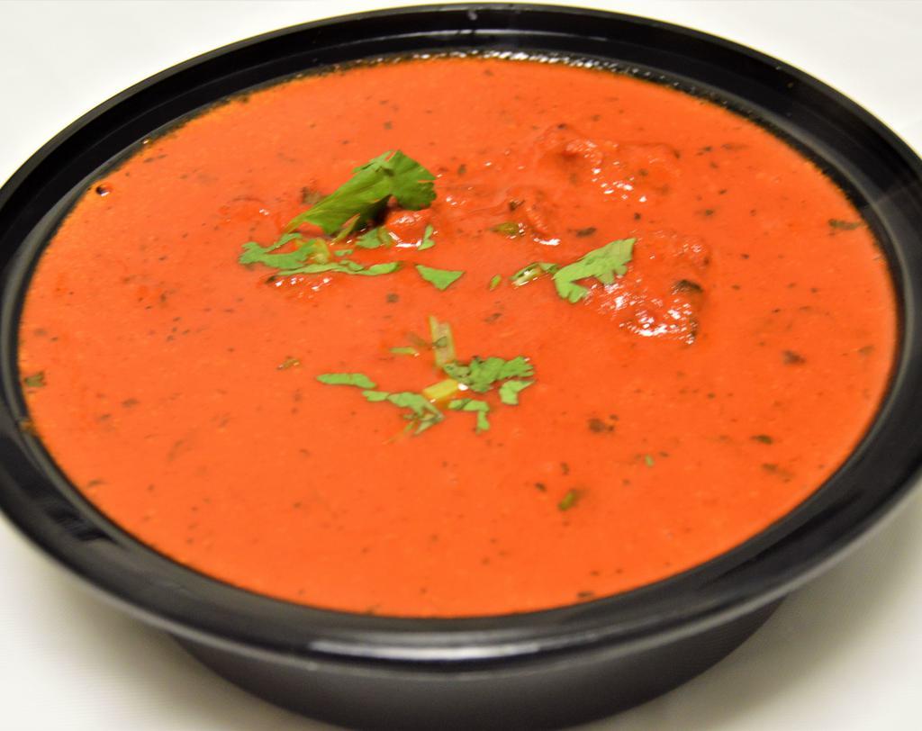 51. Butter Chicken · Chicken cooked in an exquisite and creamy tomato sauce. Served with rice.
