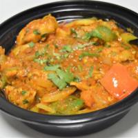 52. Chicken Karahi · Cooked with spices, onion, bell pepper and tomato. Served with rice.