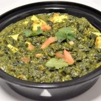 65. Palak Paneer · Spinach cooked with cheese. Served with rice.