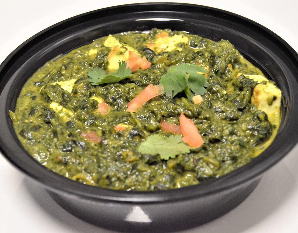 65. Palak Paneer · Spinach cooked with cheese. Served with rice.