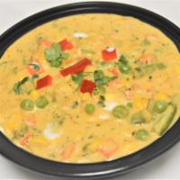 67. Navratan Korma · A rich combination of veggies cooked with mild spices, creamy mild sauce, almonds, nutmeg an...