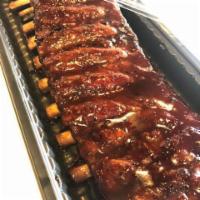 Ribs · St. Louis style pork spare ribs slow-smoked for 6 hours.
Then sauced with any of our housema...