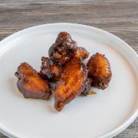 Wings · Mesquite smoked chicken wings, then flash fried for crispness. Tossed in any of our housemad...