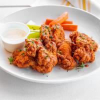Wings Plate · Served with celery sticks and tossed in your choice of chipotle BBQ, spicy buffalo sauce or ...