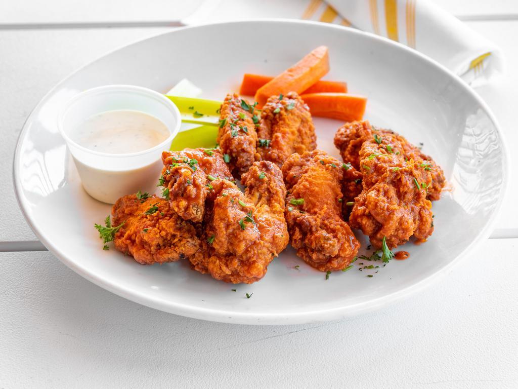 Wings Plate · Served with celery sticks and tossed in your choice of chipotle BBQ, spicy buffalo sauce or mad Nashville hot chicken sauce. Choice of buttermilk ranch or blue cheese dressing.