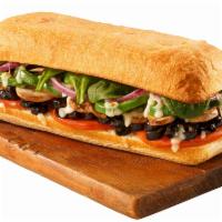 Pesto Vegetarian Sub · Loaded with tomatoes, black olives, fresh mushrooms, green peppers, red onions, fresh baby s...