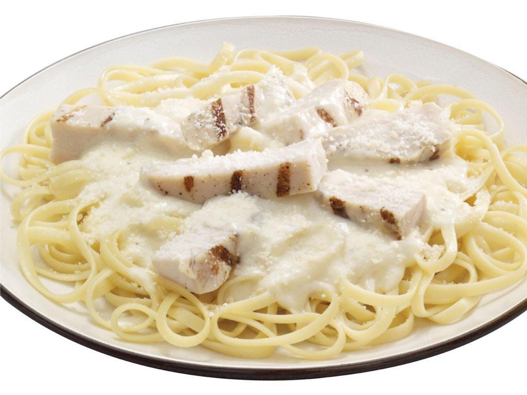 Chicken Alfredo Pasta · A bed of pasta and grilled chicken strips in alfredo sauce and finished with Pecorino Romano cheese.