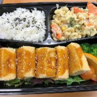 Tofu Teriyaki and Sushi Rolls · Served with rice and salad. Served with choice of sushi rolls.