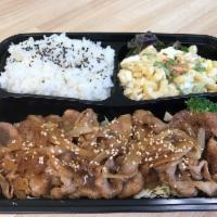 Shogayaki Bento · Sauteed sliced pork and onion with soy ginger sauce. Served with rice and pasta salad.