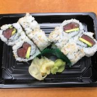 Tuna and Avocado Sushi Roll · Seaweed wrapped around rice and filling.