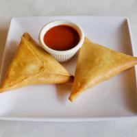 Sambusa · A pair of baked Ethiopian style phyllo dough pockets with savory filling. Choice of meat or ...
