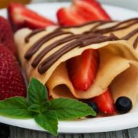 Crepe aux Fraises Chocolat · Fresh strawberries, nutella, whipped cream and powdered sugar.