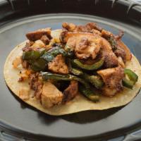Fajita Chicken Taco · Seasoned chargrilled chicken topped with grilled poblano peppers and red onions.