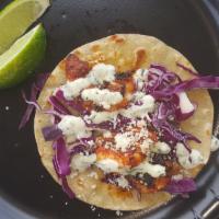 Blackened Shrimp Taco · Grilled shrimp blackened and topped with shredded red cabbage, fresh cilantro lime sauce and...