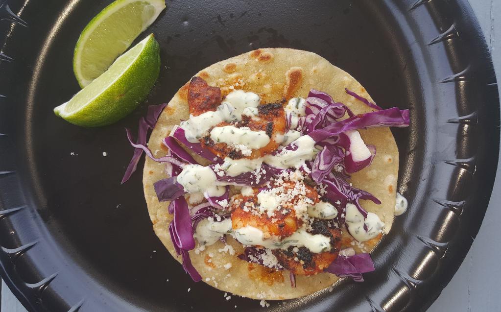Blackened Shrimp Taco · Grilled shrimp blackened and topped with shredded red cabbage, fresh cilantro lime sauce and Cotija cheese.