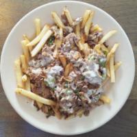 ***Works Cheesesteak Fries · Steak with grilled onion, mushroom, green bell pepper & melted white American cheese on a be...