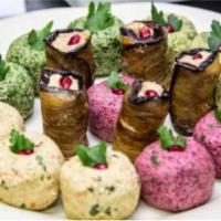 1. Tasting Board · Bite-sized vegetable roles traditional Georgian phalli, with walnuts spread and aromatic her...