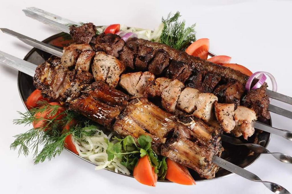 28. Chicken Kebab · 5 pieces. Marinated chicken served with grilled vegetables, potato and Georgian sause adjika.