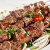 31.1  Pork Kebab · 5 pieces, tender pork marinated in white wine served with grilled vegetables, potato and Geo...