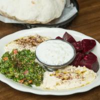 Assorted Mezze Plate · Served with your choice of 5 cold mezze. Comes with pita bread.
