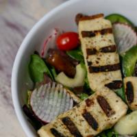 Grilled Halloumi Salad · Mixed greens , dates, grape tomatoes, mint, cucumbers & green peppers. Drizzled in zaatar re...