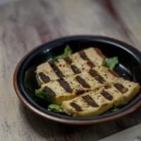Grilled Halloumi Side · Four grilled slices of Halloumi cheese