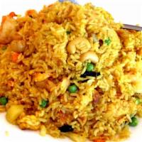 Pineapple Fried Rice · Caribbean tangy. Stir-fried of rice, pineapple, cashew nut, raisin, egg, onion with curry po...