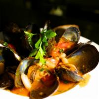 Sauteed Maine Mussels · In white wine, tomato, garlic and herb broth.