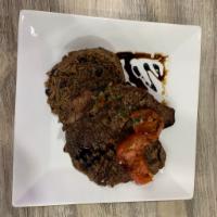 Bistec a la Parrilla · Grilled steak.