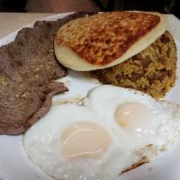 Calentado Colombiano Carne Asada y Huevos Fritos · Colombian calentado, palomilla steak, rice and beans, fried eggs, and corn cake, caffe late....