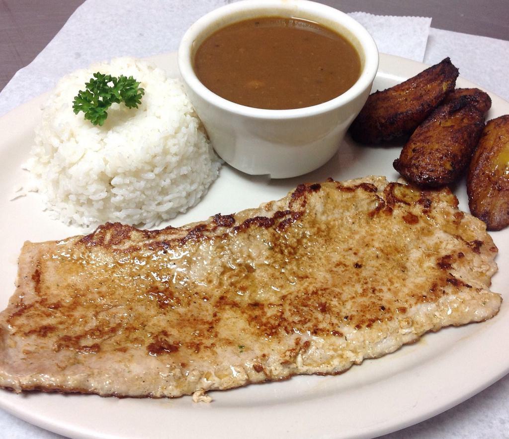 Lomo de Cerdo a La Plancha · Grilled pork loin, White rice,French fries and red beans.