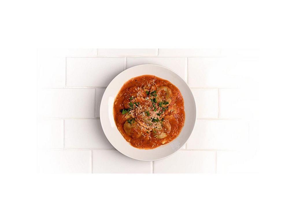 Braised Short Rib Ravioli · Tomato-butter sauce with mushrooms, onions, red wine, parmesan 