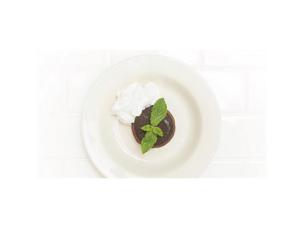 Tartufo · Warm triple chocolate cake with a chocolate truffle center, served with whipped cream. This menu item cannot be made gluten-free.