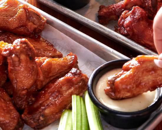 10 Bone In Wings · Tossed in your sauce of choice, served with celery and ranch or bleu cheese