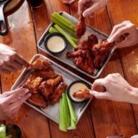 20 Bone In Wings · Tossed in your sauce of choice, served with celery and ranch or bleu cheese