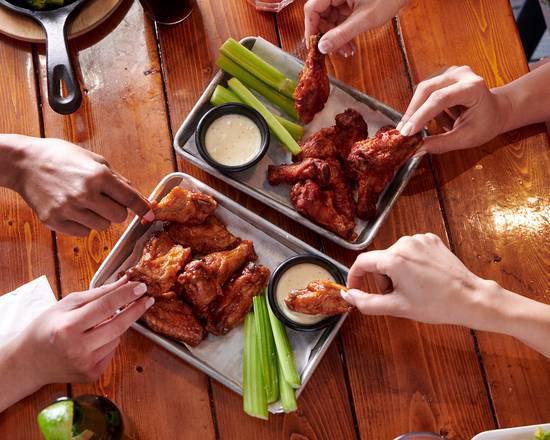 20 Bone In Wings · Tossed in your sauce of choice, served with celery and ranch or bleu cheese