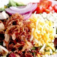 BoomerJack’s Cobb Salad · Grilled chicken, avocado, bacon, tomatoes, bleu cheese crumbles, mixed jack and cheddar chee...