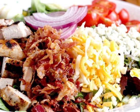 BoomerJack’s Cobb Salad · Grilled chicken, avocado, bacon, tomatoes, bleu cheese crumbles, mixed jack and cheddar cheese, boiled egg and red onion rings. Served with avocado ranch dressing on the side