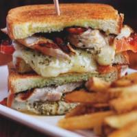 Pesto Chicken Melt · Grilled chicken, herb roasted tomatoes, fontina and monterrey jack cheese melted on brioche ...