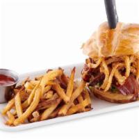 The Triple B Burger · Beef, bacon, and brisket. Topped with onion strings on a pretzel roll. Half pound of ground ...