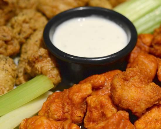 Boneless Wings Dinner · Half Pound of Boneless Chicken breaded to order. Served with Ranch and Celery and your choice of a side