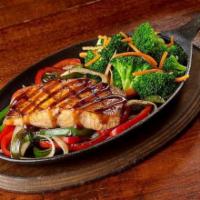 Teriyaki-Glazed Salmon · Salmon Filet atop a bed of sauteed onion and bell peppers. Served with steam veggies, garlic...