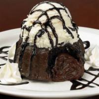Molten Chocolate Lava Cake · Topped with Fudge/Chocolate and served with side of Ice Cream
