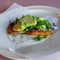 Fish Taco · Topped with red cabbage, cilantro, and avocado.