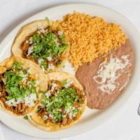 3 Taco Dinner · served with rice and beans.